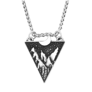 Pendentif cowboy paysage des Rocheuses sous la lune