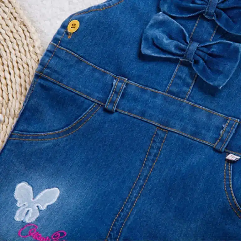 Salopette jean fille bleue nœuds et papillons