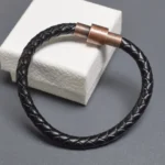 Bracelet cuir noir tressé fermoir métallique cylindrique